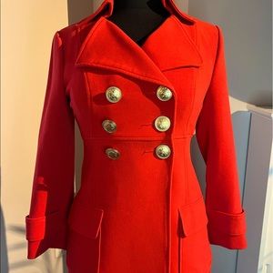 Vibrant and stylish orange trench coat